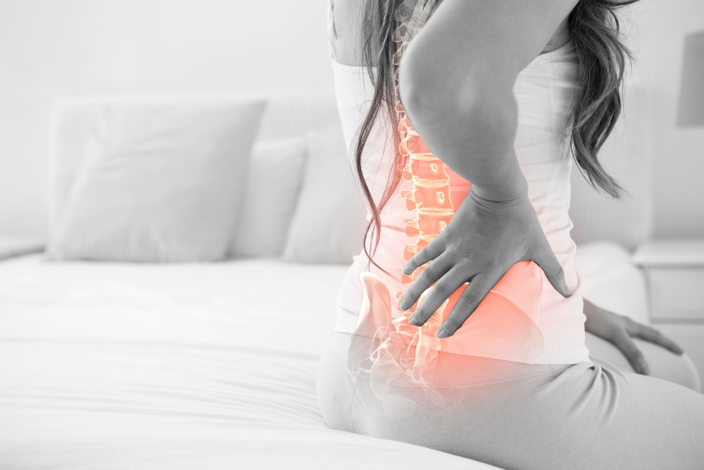 Female back pain Osteopath Oakville
